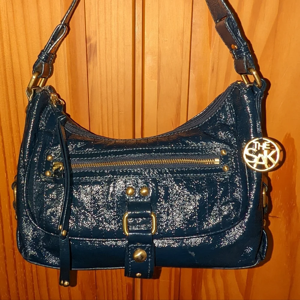 The  Sak navy blue patent leather hobo bag.